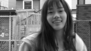 03: Girl smiling at camera. Close-Up (Bordwell and Thompson, 189) & Flat Space (Block, 16-18).