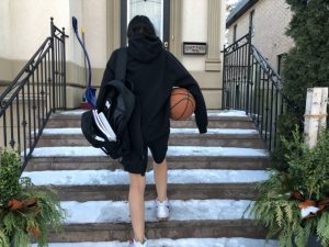 10: Student athlete is finished practicing and is going back inside to finish schoolwork. Medium long shot (Bordwell and Thompson, 189).