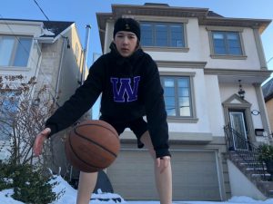 07: Student athlete starts to warm up by dribbling the ball. Medium long shot (Bordwell and Thompson, 189) and deep space, movement (Block, 28) and three-point perspective (Block, 22).