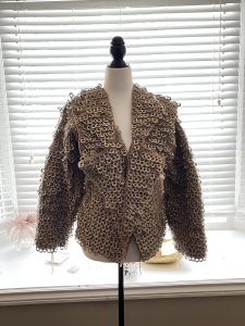 Recycled pop tab jacket/vest with sleeves on mannequin
