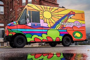 Colourfully painted Canada Post truck.