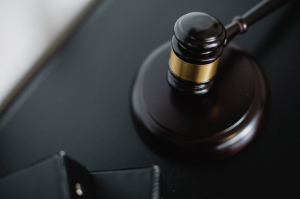 Overhead image of a gavel on a black desk