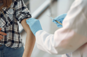 Person receiving a vaccine in their arm