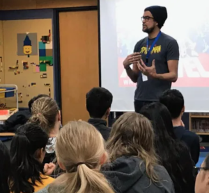 Cree author David A. Robertson is seen here talking to schoolchildren.