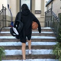 10: Student athlete is finished practicing and is going back inside to finish schoolwork. Medium long shot (Bordwell and Thompson, 189).
