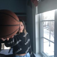 05: She picks up a basketball and becomes a little happier. Medium shot (Bordwell and Thompson, 189) and deep space, overlap (Block, 41).
