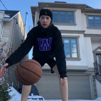 07: Student athlete starts to warm up by dribbling the ball. Medium long shot (Bordwell and Thompson, 189) and deep space, movement (Block, 28) and three-point perspective (Block, 22).
