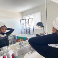 04: Isabella fixing her wrap towel in the mirror. One-Point Perspective (Block, 16-18)