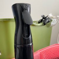 06: The spray bottle that is used throughout “wash day”. Focus (Block, 42) and Flat Space (Block)