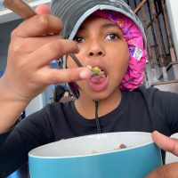 08: Isabella eating while deep conditioning her hair. Canted Level (Bordwell and Thompson, 188)