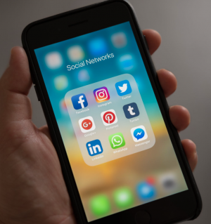 Pandemic sparking rage on social media iPhone with multiple social media applications