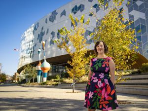 MLIS grad named CEO of Calgary Public Library Sarah Meilleur standing in front of the Calgary Public Library