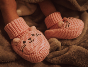 Gender skew in info for new parents Pink baby slippers