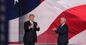 Conspiracy theorists twist evidence Donald Trump and Mike Pence standing in front of American flag