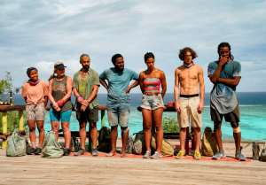 Western alumna wins Survivor Seven contestants of the TV show Survivor standing in a line